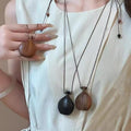 Bohemian Wax Cord Wood Kettle Pendant Sweater Necklace For Women Copper Zircon Geometric Ethnic Style view 3