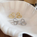 18K Gold Plated Metal Heart Earrings With Silver Pins, Twisted Hollow Minimalist Stud Design view 2