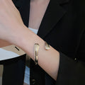 European American Glossy Metal Crossed Teardrop Leaf Open Bangle Fashion Jewelry view 3