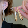 Metallic Glossy Irregular Teardrop Iron Stud Earrings For Women, Minimalist Style view 1