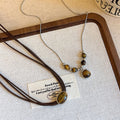Light Luxury Vintage Tiger Eye Round Geometric Pendant Sweater Necklace For Women view 4