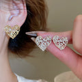 Light Luxury Zircon Heart Hollow Metal Stud Earrings With Silver Pins view 2