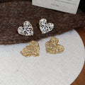 Light Luxury Zircon Heart Hollow Metal Stud Earrings With Silver Pins view 3