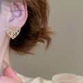 Light Luxury Zircon Heart Hollow Metal Stud Earrings With Silver Pins view 4