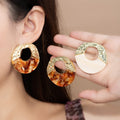 Elegant Gold Spliced Round Hollow Amber Tortoise Acrylic Alloy Statement Stud Earrings view 1