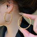 14K Gold Plated Copper Twisted Round Hoop Earrings Minimalist Luxury Style For Women view 1