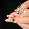 Old Money Style Feather Leaf Stud Earrings With Oval Blue Sapphire Accent Designer Accessories view 4