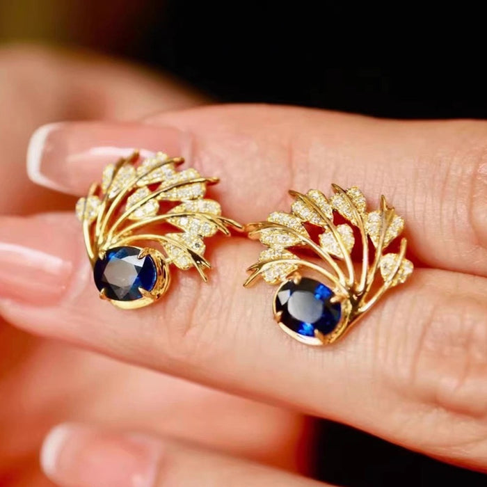 Old Money Style Feather Leaf Stud Earrings With Oval Blue Sapphire Accent Designer Accessories