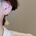 French Court Style Alloy Round Hollow Lantern Pendant Drop Earrings With Textured Geometric Design view 3