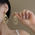 Light Luxury Metal Multi Layer Hollow Teardrop Twist Pendant Drop Earrings For Women view 2