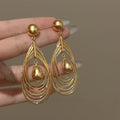 Light Luxury Metal Multi Layer Hollow Teardrop Twist Pendant Drop Earrings For Women view 3
