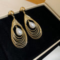 Light Luxury Faux Pearl Teardrop Drop Earrings With Silver Pin Hollow Round Layered Design view 4