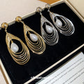Light Luxury Faux Pearl Teardrop Drop Earrings With Silver Pin Hollow Round Layered Design view 2