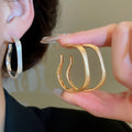 Matte Gold Plated Irregular Metal Hoop Earrings With Silver Pins Minimalist Geometric Style view 1