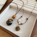 Old Money Style Tiger Eye Heart Pendant Sweater Necklace With Ceramic Geometric Round Charm view 1