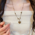 Old Money Style Tiger Eye Heart Pendant Sweater Necklace With Ceramic Geometric Round Charm view 4