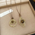 Light Luxury Vintage Iron Sweater Necklace With Tiger Eye Geometric Diamond Pendant view 4