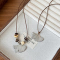 Stainless Steel Ginkgo Leaf Pendant Sweater Necklace Elegant Minimalist Luxury Statement Jewelry for Women view 2
