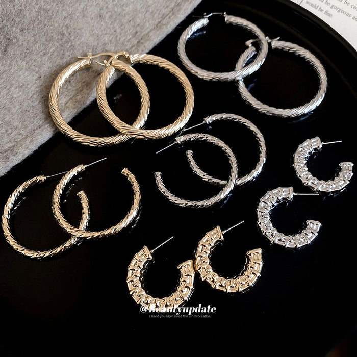 Minimalist Geometric Round Iron Hoop Earrings With Silver Posts And Crinkled Smooth Metal Finish