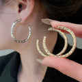 Minimalist Geometric Round Iron Hoop Earrings With Silver Posts And Crinkled Smooth Metal Finish view 2