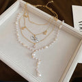 Light Luxury Rhinestone Star Moon Faux Pearl Layered Sweater Necklace Vintage Geometric Collarbone Chain view 4