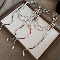 Light Luxury Faux Pearl Crystal Double Layer Beaded Sweater Necklace With Geometric Round Design view 4