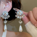 Elegant Faux Pearl Teardrop Drop Earrings With Floral Rhinestone Silver Pin Design view 1