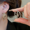Minimalist Metal Round Hollow Hoop Earrings Unique Geometric Light Luxury Commuter Jewelry view 3
