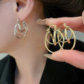 Minimalist Metal Round Hollow Hoop Earrings Unique Geometric Light Luxury Commuter Jewelry view 1
