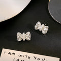 Elegant Crystal Bow Pearl Stud Earrings For Women Luxury Rhinestone Alloy Niche Design Versatile Earrings view 4
