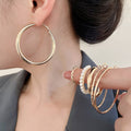Minimalist Iron Jewelry Set With Smooth Geometric Hoop Earrings And Pearl Accents view 4