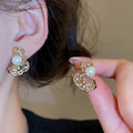 Copper Zircon Twisted Hollow Pearl Stud Earrings Irregular Geometric Luxury Style view 4