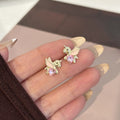 Elegant Gold Alloy Unicorn Studs With Pink Crystal Heart And White Enamel Wings Cute Fashion Earrings view 2
