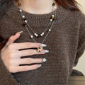 Maillard Style Faux Pearl Tiger Eye Wood Horse Pendant Sweater Necklace view 3