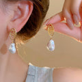 Gold Plated Silver Post Hollow Oval Faux Pearl Stud Earrings French Vintage Light Luxury view 1