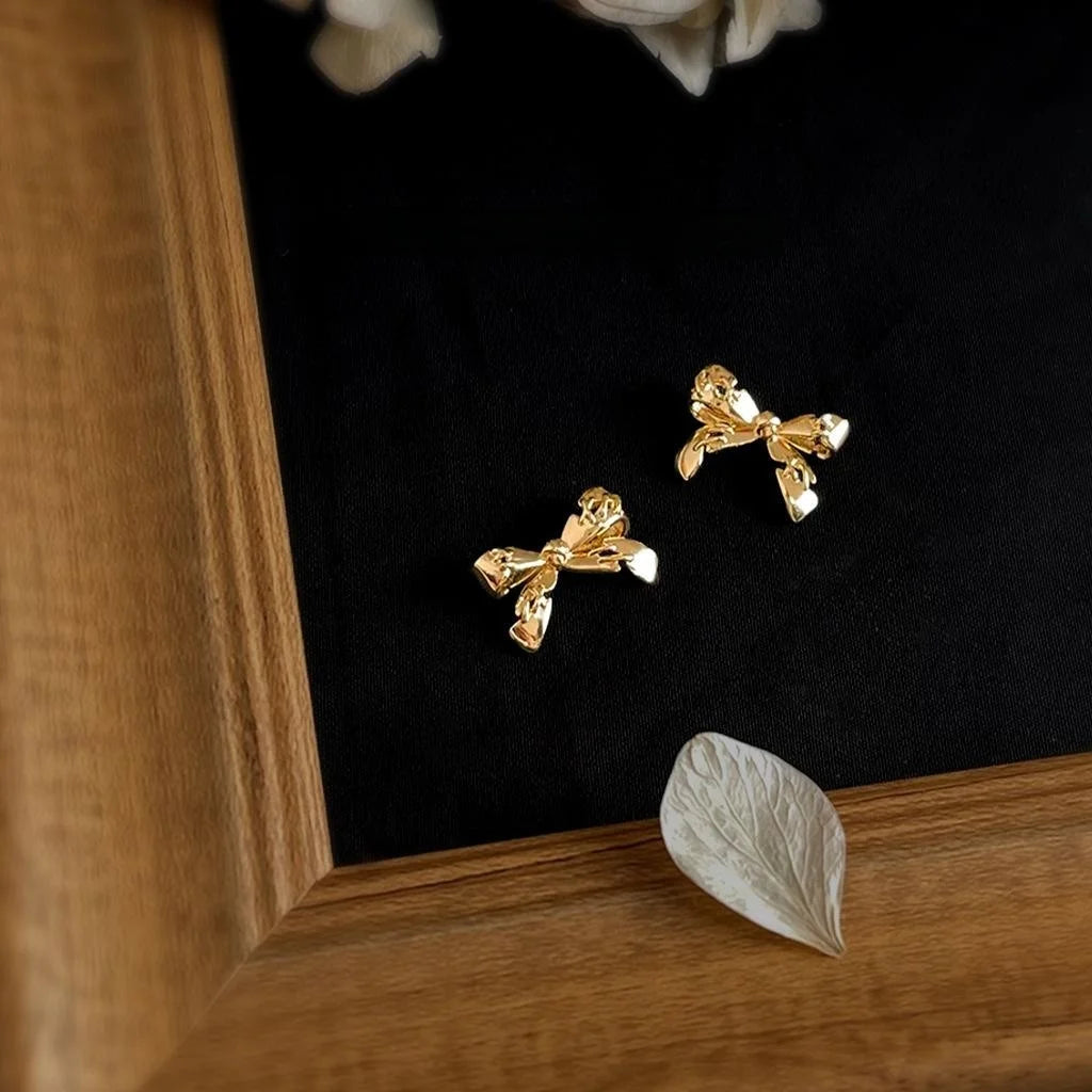 14K Plated Eco-Friendly Copper Bow Stud Earrings With Stitched Crack Design Style
