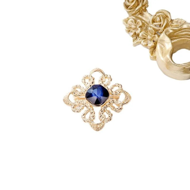 Elegant Gold Alloy Brooch With Deep Blue Glass Crystal And Rhinestone Knot Design Lapel Pin Gift