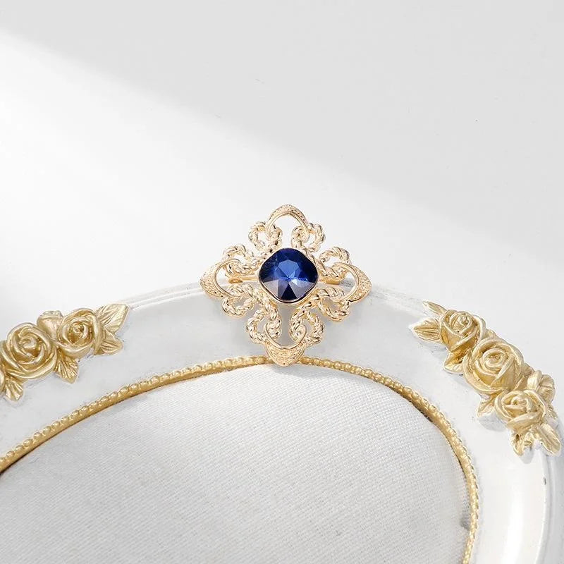 Elegant Gold Alloy Brooch With Deep Blue Glass Crystal And Rhinestone Knot Design Lapel Pin Gift