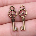 26x9mm 0.9g Antique Bronze Tone Zinc Alloy Peace Symbol Key Charm Pendant for DIY Jewelry Making