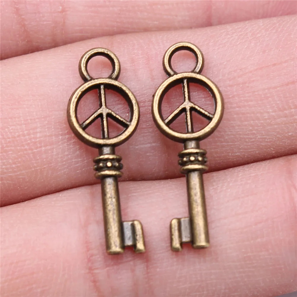 26x9mm 0.9g Antique Bronze Tone Zinc Alloy Peace Symbol Key Charm Pendant for DIY Jewelry Making