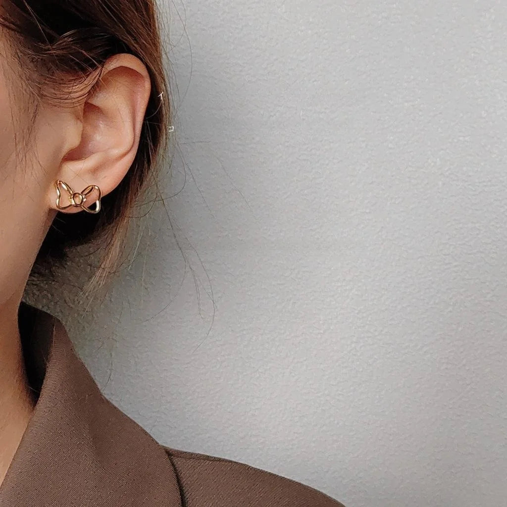 Sweet Copper Asymmetric Bow Heart Stud Earrings With Hollow Micro Pave Zircon