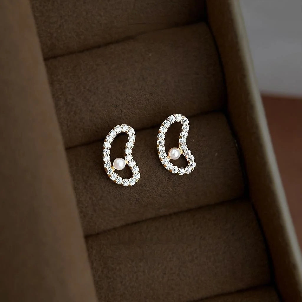 Simple Copper Micro Pave Zircon Pea Stud Earrings With Pearl Hollow Curved Geometric Design