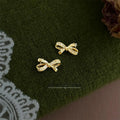 Light Luxury Micro Pave Zircon Bow Stud Earrings Copper Star Accent