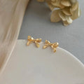 14K Plated Eco-Friendly Copper Bow Stud Earrings With Stitched Crack Design Style