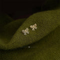 14K Gold Plated Copper Mini Hollow Bow Stud Earrings For Women