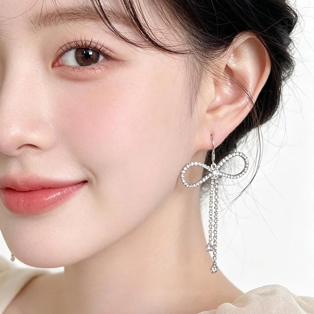 Korean Sweet Cool Copper Bow Drop Earrings With Silver Plated Pins And Rhinestone Accents