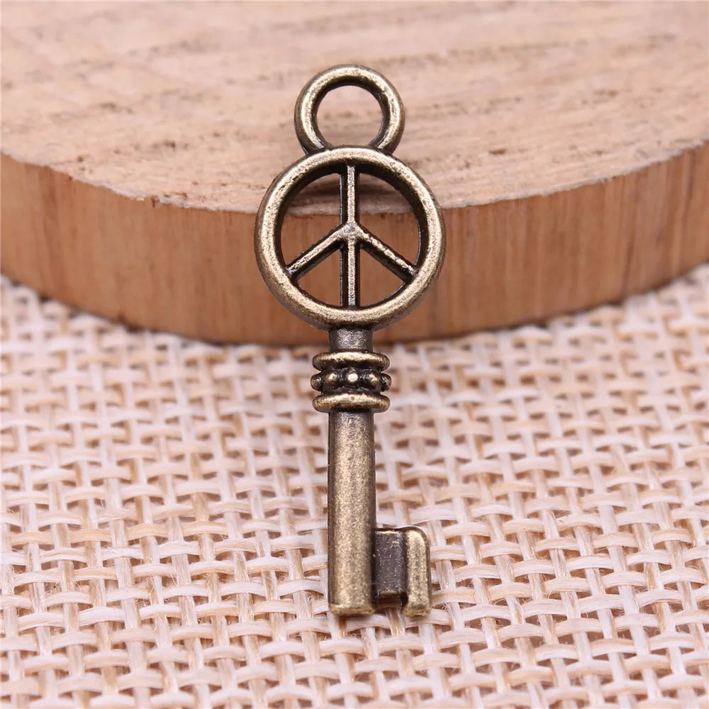 26x9mm 0.9g Antique Bronze Tone Zinc Alloy Peace Symbol Key Charm Pendant for DIY Jewelry Making