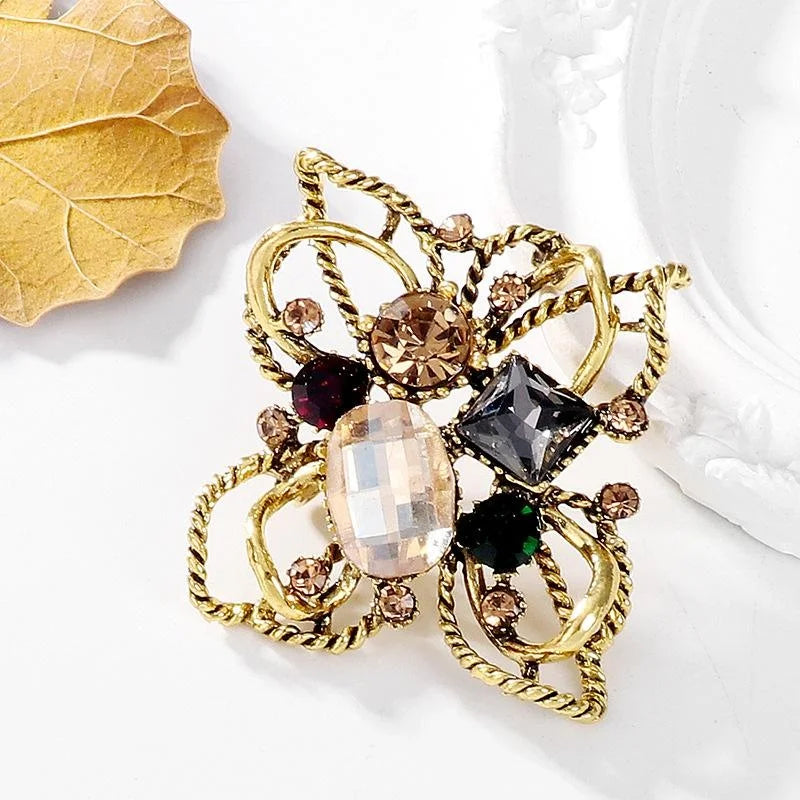 Vintage Baroque Floral Alloy Rhinestone Brooch With Twisted Gold Tone Petals, Elegant Lapel Pin Gift