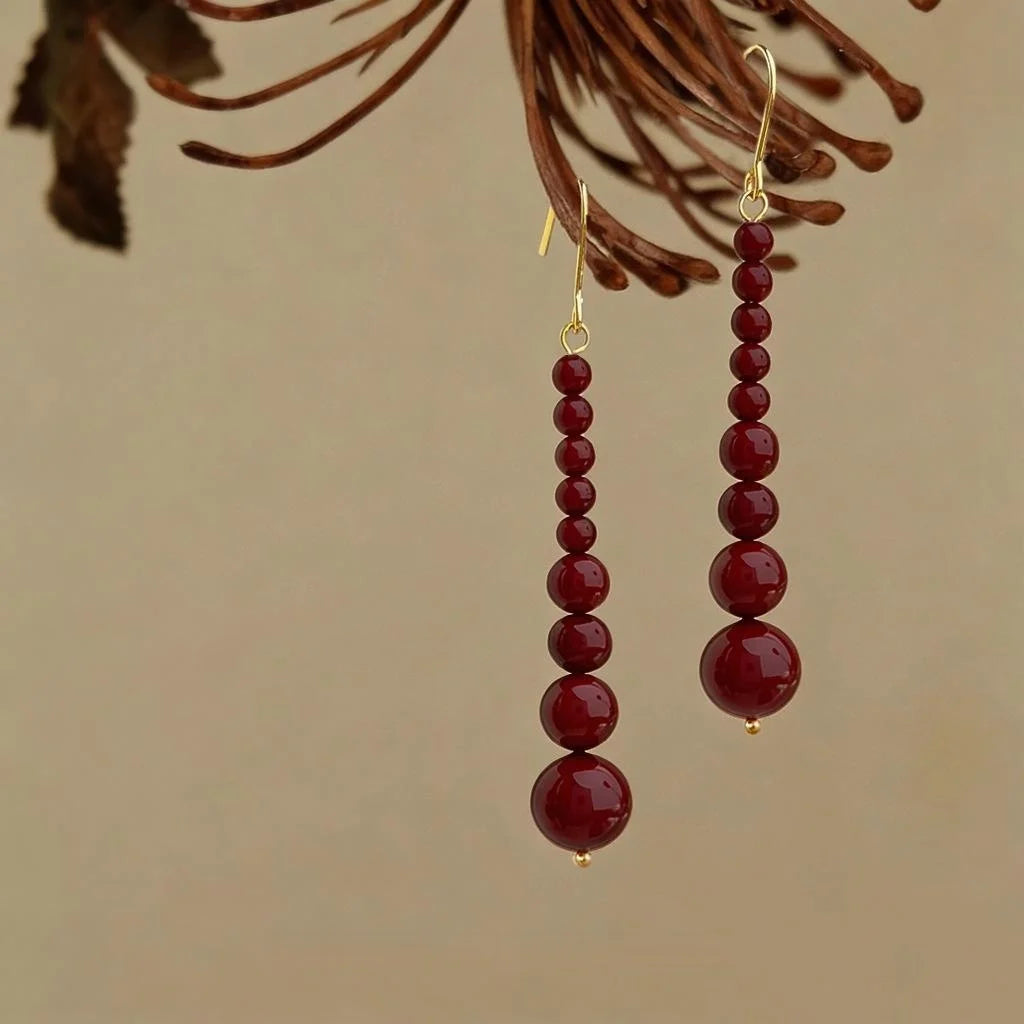 Hepburn Style Red Glass Pearl Tassel Drop Earrings With Copper Geometric Design