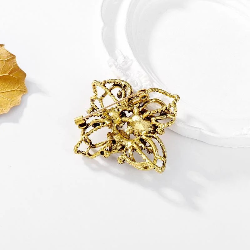 Vintage Baroque Floral Alloy Rhinestone Brooch With Twisted Gold Tone Petals, Elegant Lapel Pin Gift